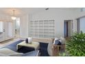 Bright living room with a built-in bookshelf, neutral colors, and plenty of natural light at 1169 Presque Isle Dr, Port Charlotte, FL 33952