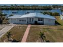 Charming home features a well-maintained front lawn and an attached one-car garage at 137 Poinsettia Ne Cir, Port Charlotte, FL 33952