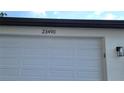 The garage door of this home at 23490 has impact resistant windows at 23490 Macbeth Ct, Punta Gorda, FL 33980