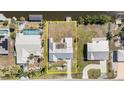 Aerial view showcasing property lines and the home's location, with a pool, on a spacious lot at 3100 Magnolia Way, Punta Gorda, FL 33950