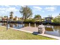 Waterfront property with a private dock for boating and enjoying scenic canal views at 3100 Magnolia Way, Punta Gorda, FL 33950