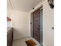 Condo entrance with dark brown door at 311 Garvin St # 401C, Punta Gorda, FL 33950