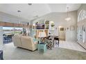 Bright living room with high ceilings, large windows, and stylish furnishings for comfortable living at 507 Monaco Dr, Punta Gorda, FL 33950