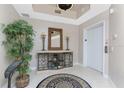 Lobby area near an elevator with tile flooring, decor, and an elevator at 87 Vivante Blvd # 8732, Punta Gorda, FL 33950