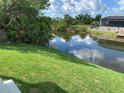 Beautiful view of the pond in the backyard adds nature and beauty to this property at 13902 Allamanda Cir, Port Charlotte, FL 33981