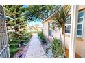Inviting front entrance with a landscaped walkway and charming details at 26287 Stillwater Cir, Punta Gorda, FL 33955