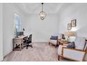 Bright office space with neutral walls, a desk, and seating area under a trey ceiling at 42210 Lake Timber Dr, Punta Gorda, FL 33982