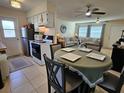 Cozy kitchen with a dining area featuring a table set for four and updated appliances at 447 Yeager St, Port Charlotte, FL 33954