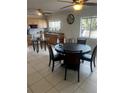 Open kitchen with stainless appliances, tiled flooring, a large island, and plenty of natural light at 5240 Malamin Rd, North Port, FL 34287