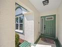 Welcoming front door with a glass accent, complemented by a decorative welcome mat at 726 Connemara Ct, Venice, FL 34292