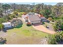 Sprawling single-Gathering home with an attached two car garage on a verdant lot at 1701 Overbrook Rd, Englewood, FL 34223