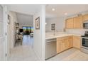 Updated kitchen featuring stainless steel appliances, tile flooring, and ample natural light at 175 Kings Hwy # 232, Punta Gorda, FL 33983