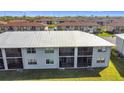 Aerial view of condo buildings, highlighting the roof and community setting at 25050 Sandhill Blvd # B2 Building 6, Punta Gorda, FL 33983
