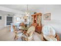 Cozy dining area with charming furniture, ample natural light, and an open layout connecting to the kitchen at 25275 Rampart Blvd # 1602, Punta Gorda, FL 33983