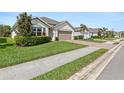 Charming single-story home with a well-manicured lawn, brick paver driveway and a two car garage at 3860 Cobblestone Ln, Punta Gorda, FL 33980