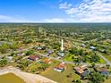 An aerial view of a neighborhood showcases the home's location within a desirable community and luscious green landscape at 5126 Richmond Ter, North Port, FL 34287