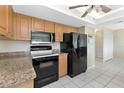 Kitchen featuring granite countertops and stainless steel appliances at 944 Genoa Ct, Punta Gorda, FL 33950