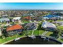 Expansive aerial view showcases a waterfront community with numerous homes and canals at 1368 Grebe Dr, Punta Gorda, FL 33950