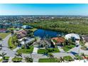 Scenic aerial view of a waterfront community with beautiful homes and lush greenery at 1368 Grebe Dr, Punta Gorda, FL 33950