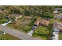 Aerial view of property showing the house, spacious yard, nearby roads, and surroundings at 17327 Wintergarden Ave, Port Charlotte, FL 33948