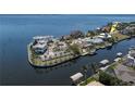 Aerial view of waterfront homes with private boat docks and beautiful landscaping in a waterfront community at 250 George Rd, Port Charlotte, FL 33952