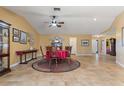 Spacious dining room featuring tile floors, ceiling fan, and adjacent living spaces at 258 Venezia Ct, Punta Gorda, FL 33950