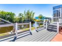 Home features a private dock with a boat lift and canal access, surrounded by lush greenery at 3024 Caribbean Dr, Punta Gorda, FL 33950