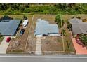 Aerial view of the property highlighting its location, surrounding neighborhood, and proximity to the road at 3566 Shamrock Dr, Venice, FL 34293