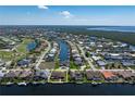 Expansive aerial view of the property showcasing its canal-front location and neighborhood amenities at 5032 La Costa Island Ct, Punta Gorda, FL 33950
