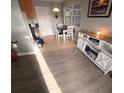 Cozy dining area with tile floor, white table and chairs, and a modern media center at 5100 Bullard St, North Port, FL 34287