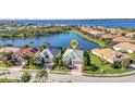 Aerial view of the property showcasing its desirable location on a lake with lush surroundings at 13056 N Marsh Dr, Port Charlotte, FL 33953