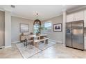 Bright dining room featuring a modern table set, stylish decor, and tile flooring at 14049 Black Beauty Dr # 721, Punta Gorda, FL 33955