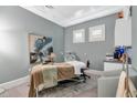 Spa room featuring treatment bed, cabinetry, decor, and light blue painted walls at 14049 Black Beauty Dr # 721, Punta Gorda, FL 33955