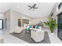 Open-concept living room featuring neutral tones and stylish furnishings, creating an inviting atmosphere at 16210 Cape Horn Blvd, Punta Gorda, FL 33955