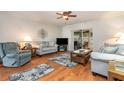 Cozy living room with wood flooring, comfortable seating, and natural light at 22375 Edgewater Dr # 149, Punta Gorda, FL 33980
