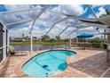 Inviting screened-in pool area with a beautiful waterfront view, perfect for relaxing at 380 Concordia St, Punta Gorda, FL 33983