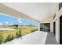 Spacious covered patio overlooking a well manicured back yard at 16440 Cape Horn Blvd, Punta Gorda, FL 33955