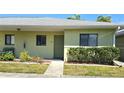 Cozy condo featuring a well-manicured lawn and a charming entrance, perfect for a relaxed living experience at 25225 Rampart Blvd # 604, Punta Gorda, FL 33983