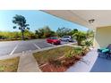 Comfortable condo boasting a private parking spot and a serene view of the surrounding greenery and the adjacent property at 25225 Rampart Blvd # 604, Punta Gorda, FL 33983