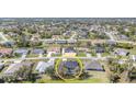 Aerial view of a residential neighborhood showcasing a home with a private backyard pool at 312 Mendoza St, Punta Gorda, FL 33983