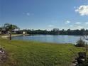 Scenic pond view with tropical landscaping at 4072 Oakview Dr # C5, Punta Gorda, FL 33980