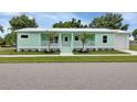 Inviting exterior view of a one-story home featuring a well-manicured lawn at 535 Milus St, Punta Gorda, FL 33950