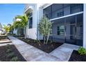 Condo exterior showing the lanai and tropical landscaping at 14234 Heritage Landing Blvd # 1016, Punta Gorda, FL 33955