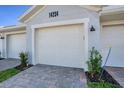 Exterior shot featuring the garage of this home with brick pavers at 14234 Heritage Landing Blvd # 1016, Punta Gorda, FL 33955
