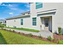 Inviting two-story home with manicured lawn and tasteful landscaping, offering curb appeal and a welcoming entrance at 15951 Grassland Ln # 3812, Punta Gorda, FL 33982