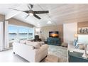 Inviting living room features waterfront views, comfortable seating, and a ceiling fan at 168 Morgan Se Ln, Port Charlotte, FL 33952