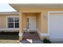 Well-maintained home featuring a covered front porch entry at 4237 Irdell Ter, North Port, FL 34288