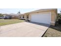 Charming home featuring a two-car garage and wide driveway at 4237 Irdell Ter, North Port, FL 34288