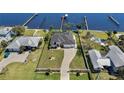 A captivating aerial view of a waterfront property with a dock, and pool at 4450 Northshore Dr, Punta Gorda, FL 33980