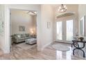 Welcoming foyer with high ceilings, tiled floors, and an adjacent sitting room at 4450 Northshore Dr, Punta Gorda, FL 33980